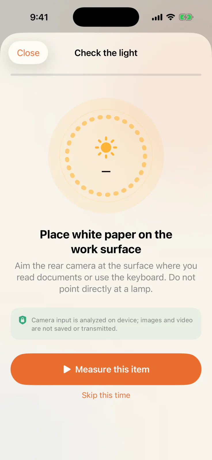 Lighting check screen instructing the user to place white paper on the work surface and aim the rear camera at it.